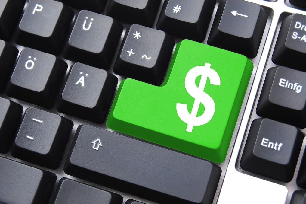 What is the ROI of a website. Keyboard with a dollar sign as the enter key.